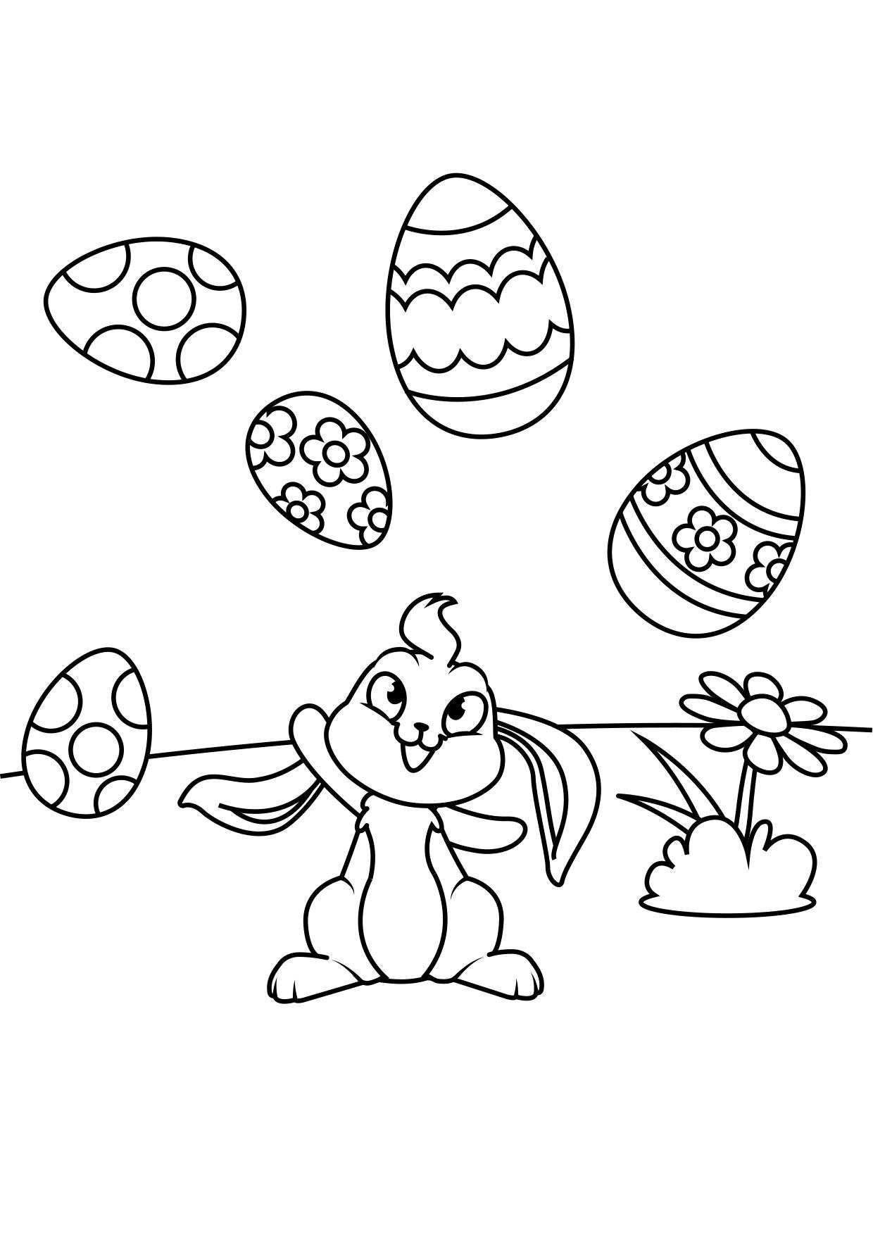 Coloriage lapin de pA¢ques joue avec des oeufs de pA¢ques